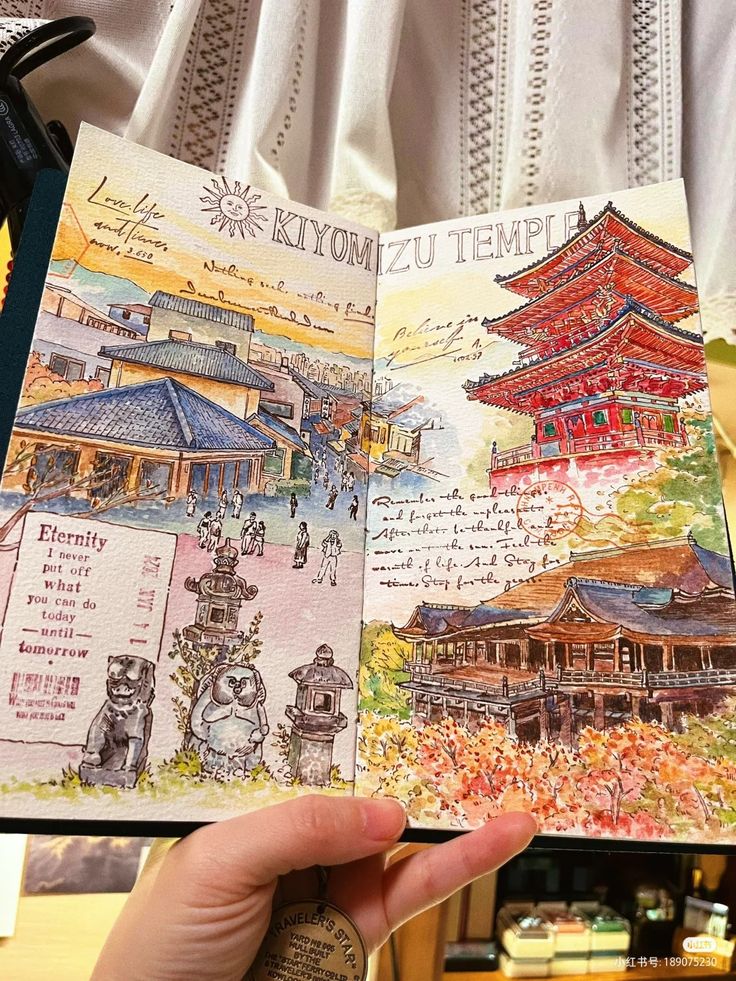 Hand-drawn travel journal page of Kiyomizu Temple with colorful sketches and notes, held up against lace curtain.