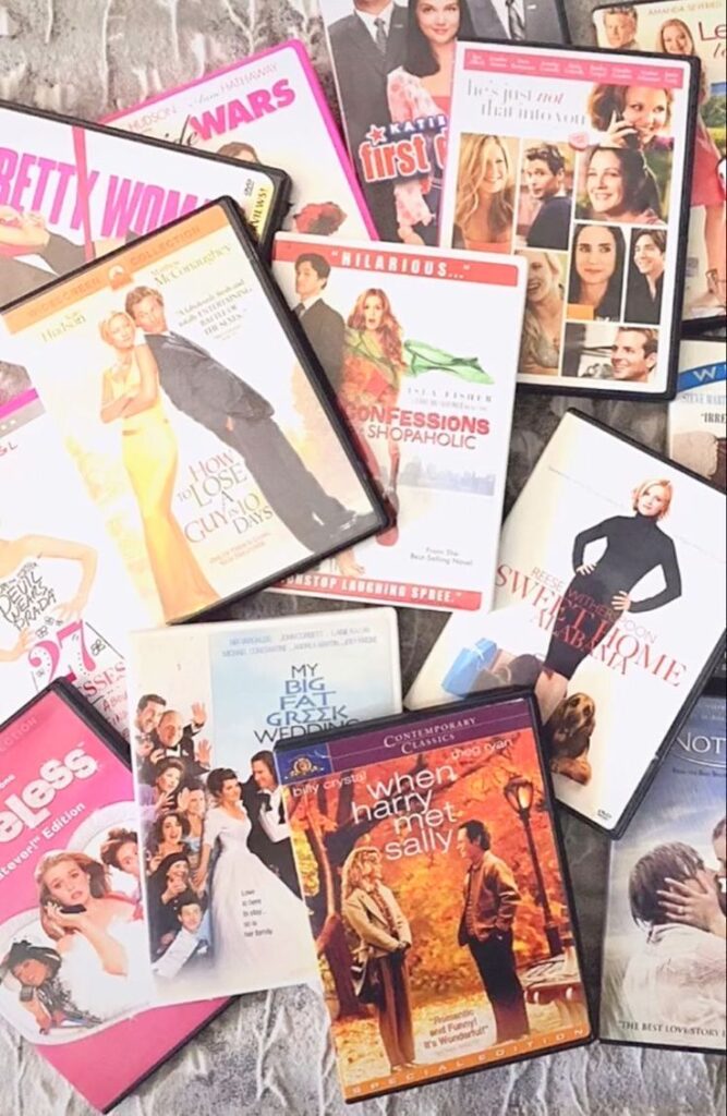 A collection of romantic comedy DVDs including classics like When Harry Met Sally and Pretty Woman displayed.