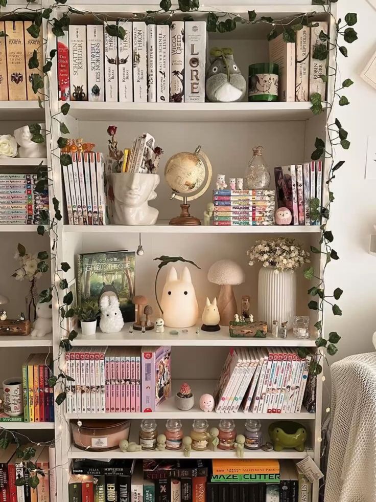 Cozy bookshelf filled with novels, manga, and cute figurines, decorated with plants and ambient lighting.