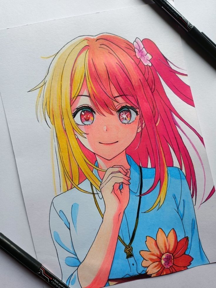 Anime girl with pink and yellow hair, wearing a blue top with a flower design, smiling at the viewer.