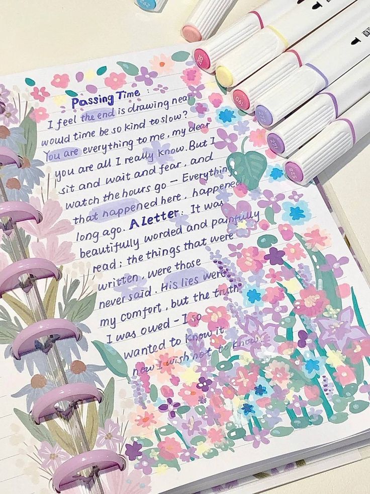 Colorful journal page with handwritten text, surrounded by pastel floral designs and markers.