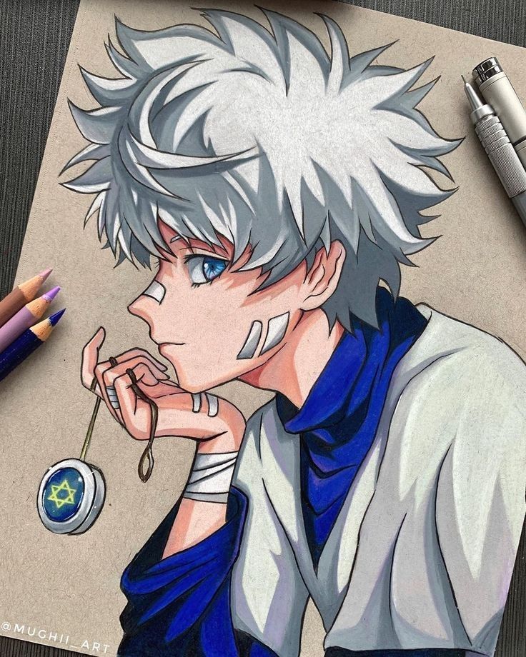 Anime character drawing with white hair, blue eyes, and a yo-yo. Surrounded by art tools on a table.