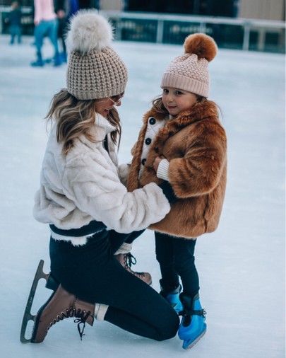 Caslon® Faux Shearling Jacket curated on LTK Mother and child ice skating, both in warm coats and pom-pom hats, enjoying winter outdoor activity. | Sky Rye Design Mother and child ice skating, both in warm coats and pom-pom hats, enjoying winter outdoor activity.