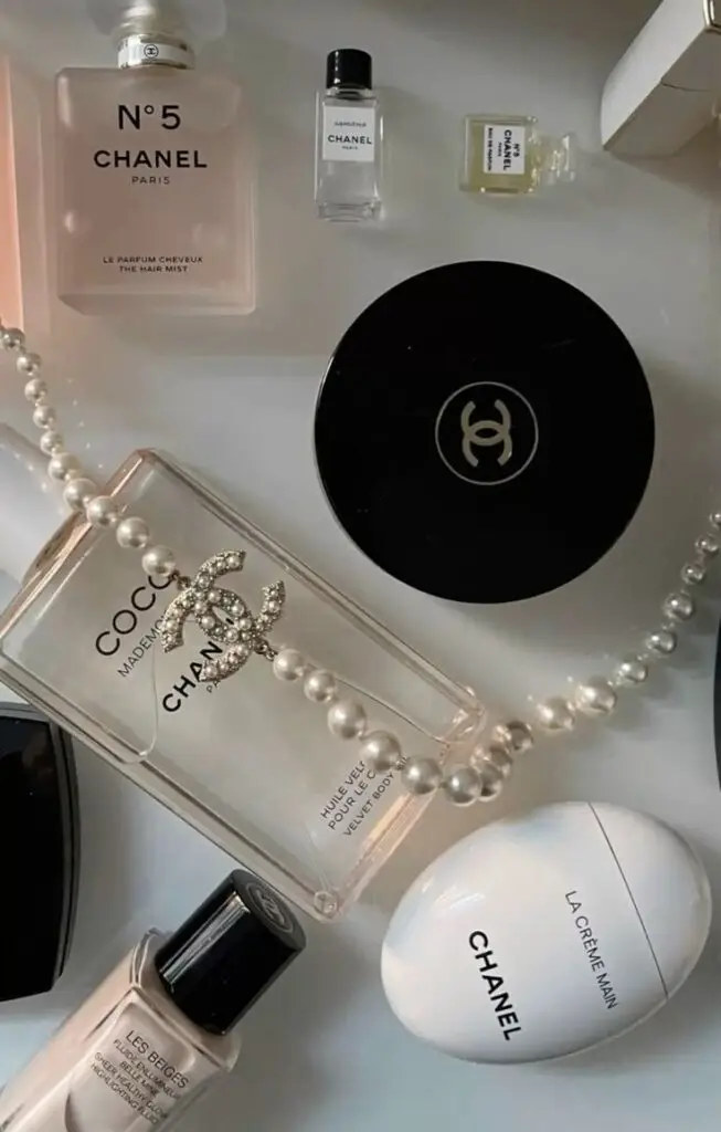 Chanel vibes 🤍 Chanel beauty products and accessories with a pearl necklace, highlighting luxury and elegance. | Sky Rye Design Chanel beauty products and accessories with a pearl necklace, highlighting luxury and elegance.