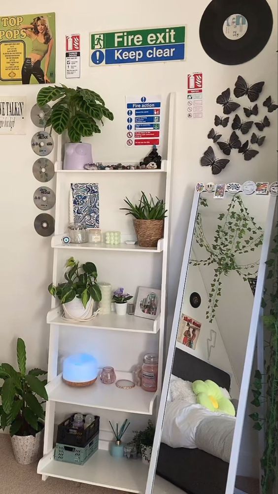 Modern room decor with plants, shelf, wall art, and a full-length mirror. Cozy and stylish interior design vibes.