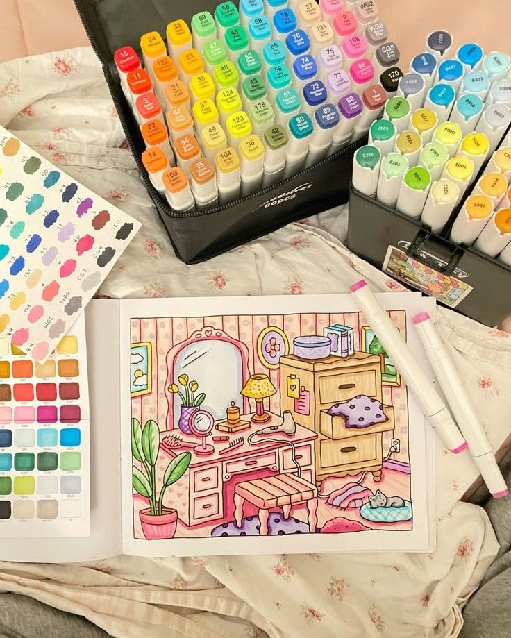 Colorful art markers and a vibrant, illustrated coloring book page on a creative workspace.