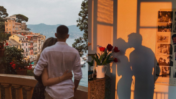 Couple embracing with scenic coastal view; sunset shadows on wall with vase and photos evoke romance.