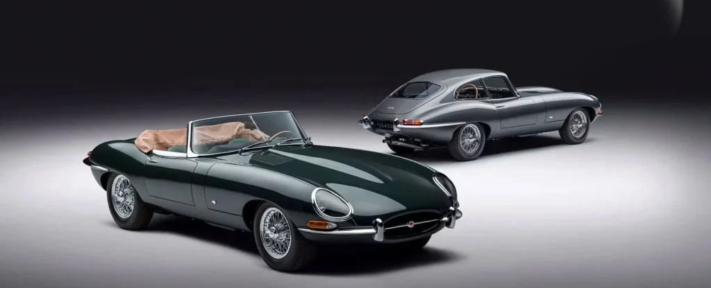 Classic vintage sports cars, green convertible and silver coupe, showcased on a sleek studio backdrop.