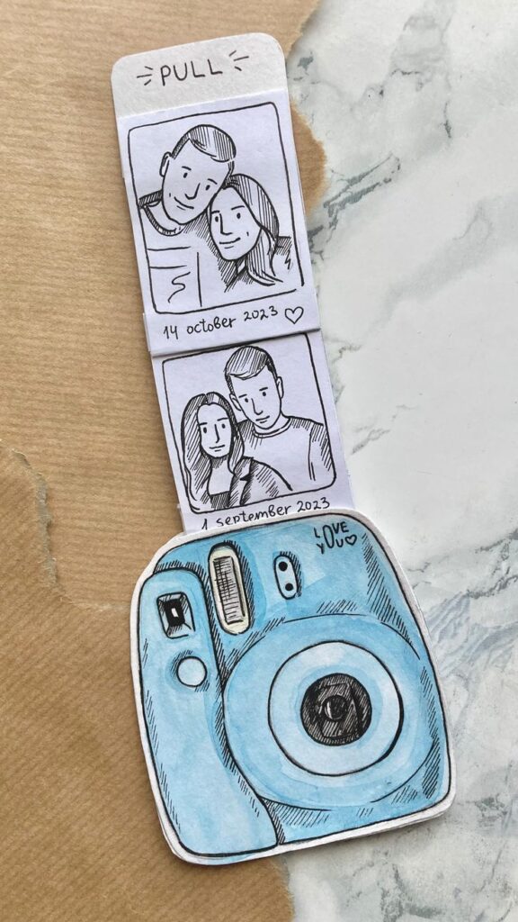 Sketch of a blue camera with two photo strips dated 14 October and 1 September 2023 on a textured background.