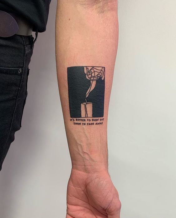 Minimalist tattoo on forearm with a candle design and text reading It's better to burn out than to fade away.