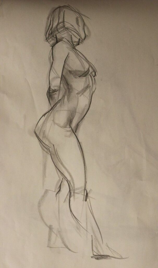 Charcoal sketch of a standing human figure, showcasing artistic anatomy and shading techniques on paper.