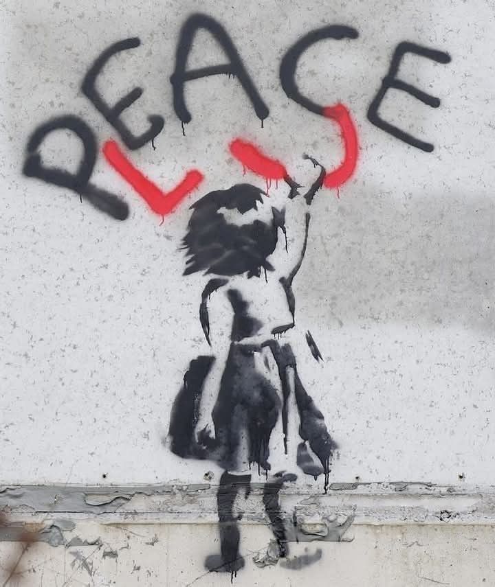 Graffiti art of a child altering peace to please with red spray paint on a wall, symbolizing a plea for peace.