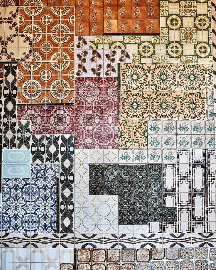 Colorful vintage tile patterns creating a patchwork mosaic wall design.