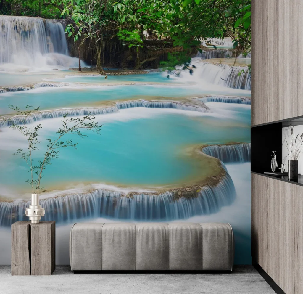 Wall mural of turquoise waterfall pools in a modern interior with a vase and a gray bench.