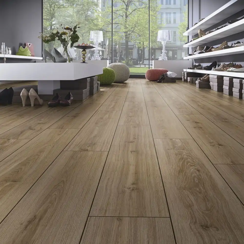 Modern shoe store with stylish shelves, elegant high heels, and warm wood flooring, viewed through large windows.