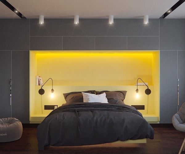 Modern bedroom with cozy lighting, stylish dark bedding, and built-in shelves for a contemporary, minimalist look.