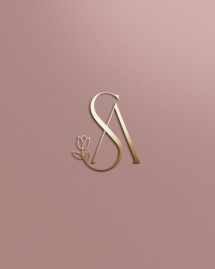 Elegant gold SA monogram with floral design on a soft brown background.