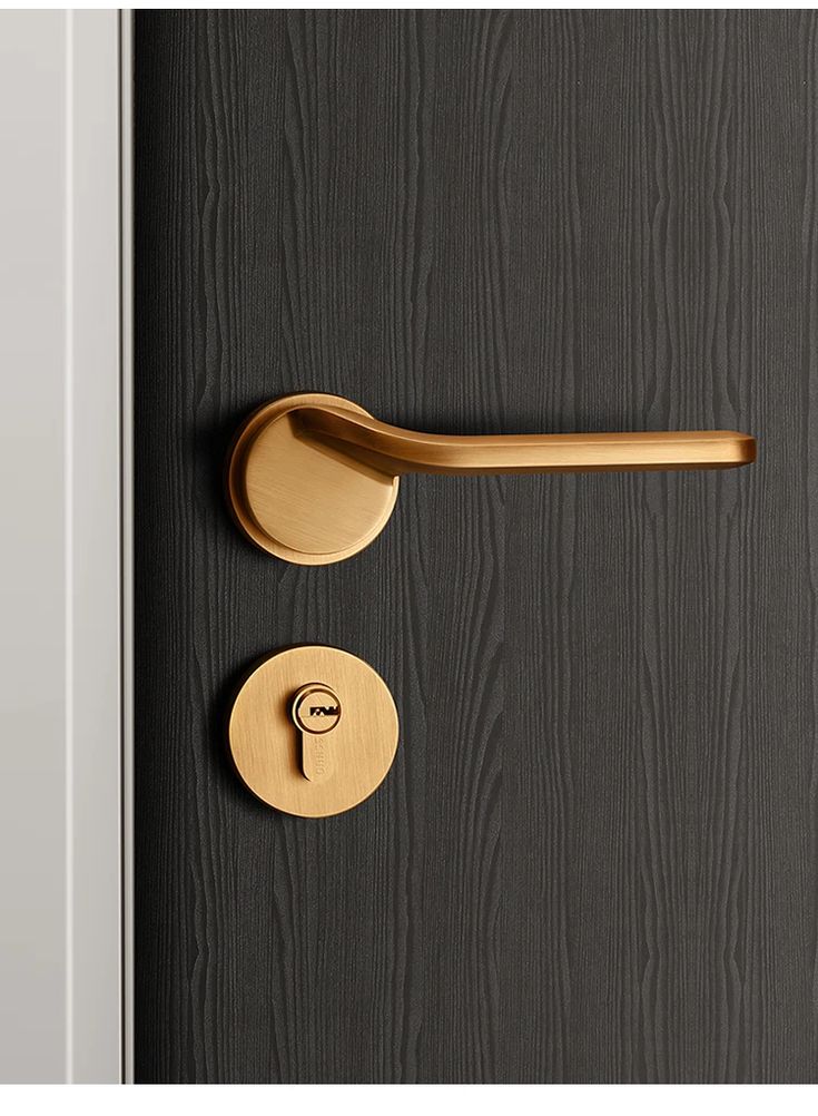 Sleek brass door handle and lock on a textured dark wood door. Ideal modern hardware for home and office.