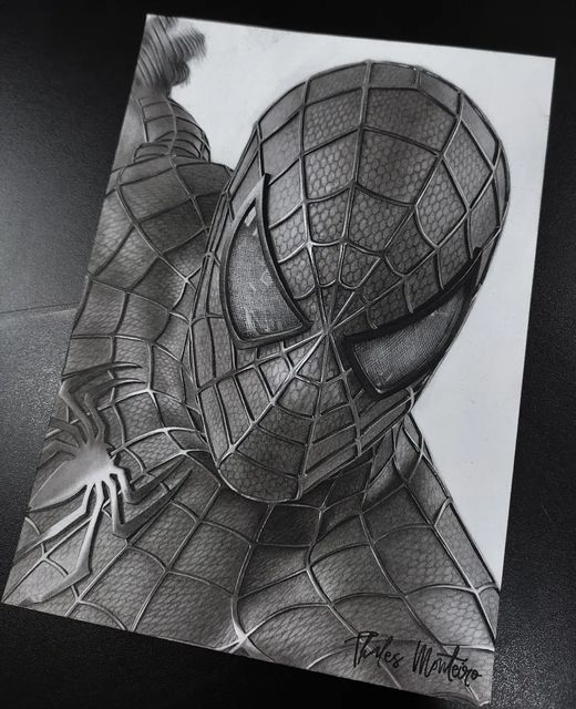 Drawing of a superhero in a detailed suit with web patterns, showcasing dynamic pose and shading.