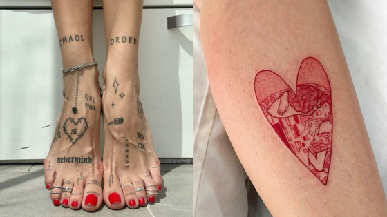 Creative foot tattoos with words and doodles, alongside a red heart tattoo with intricate design on a leg.