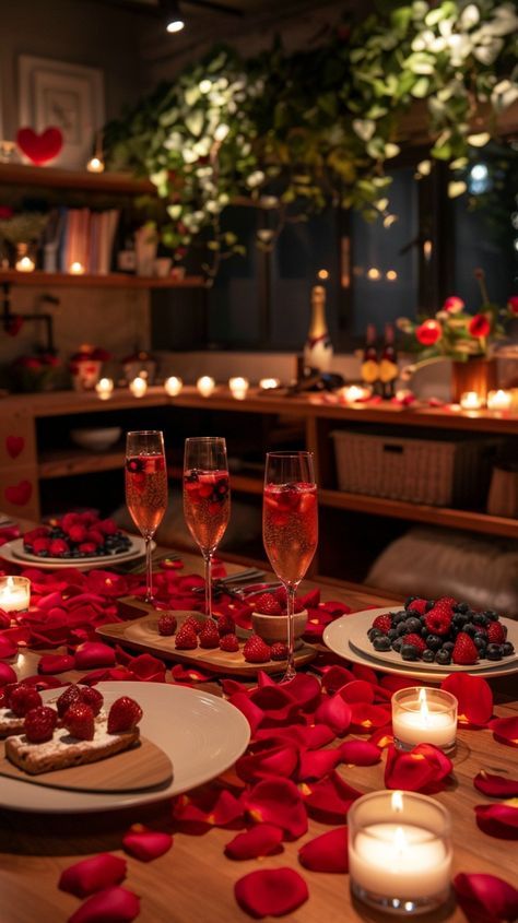 Romantic dinner setting with candles, rose petals, and champagne, featuring fresh berries and elegant lighting ambiance.