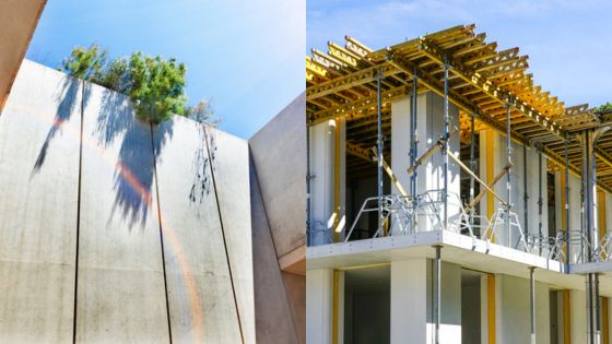 Modern building structure with green elements and construction scaffolding under a clear blue sky.