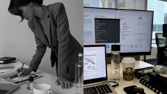 Business professional writing at desk with tech and coffee setup, emphasizing productivity and multitasking.