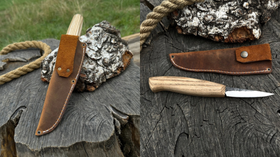 Handcrafted knife with leather sheath on rustic wood stump outdoors.