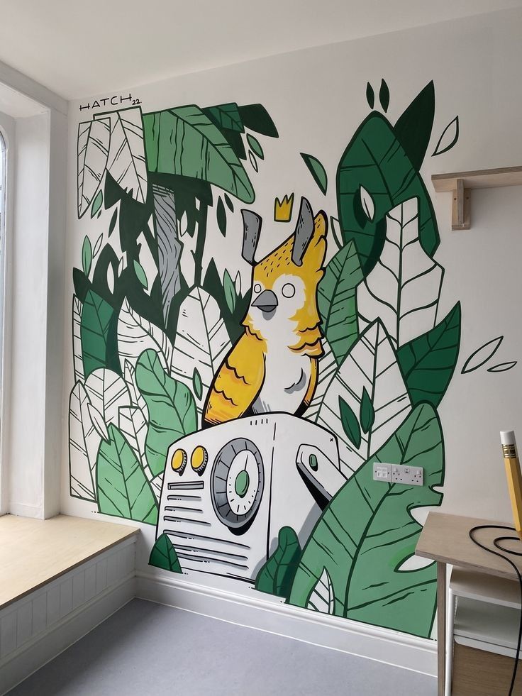 Colorful mural featuring a crowned bird amid lush green leaves in a modern, light-filled room.