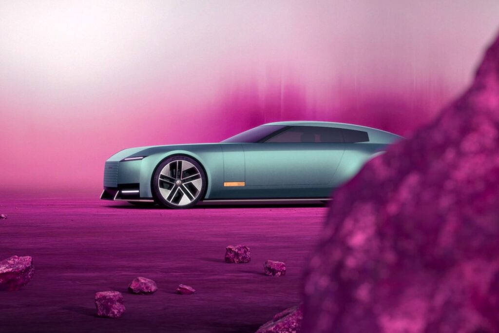 Futuristic teal car on a purple background with rocks, showcasing modern design and sleek styling.