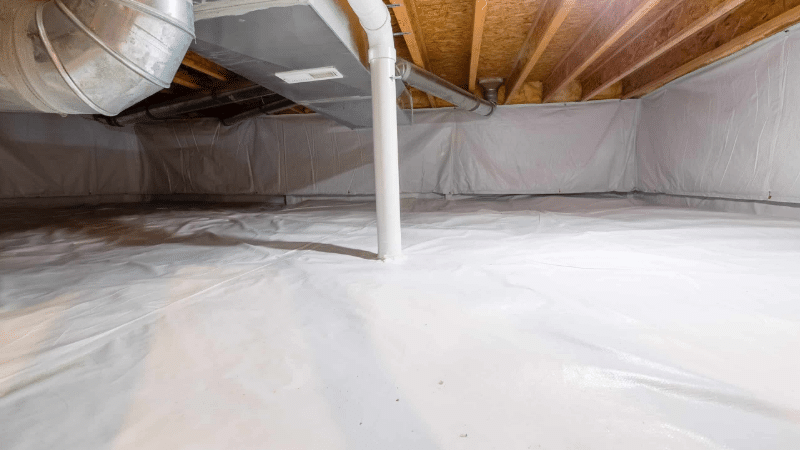 Clean, sealed crawl space with vapor barrier installation and HVAC ductwork for moisture control and improved air quality.