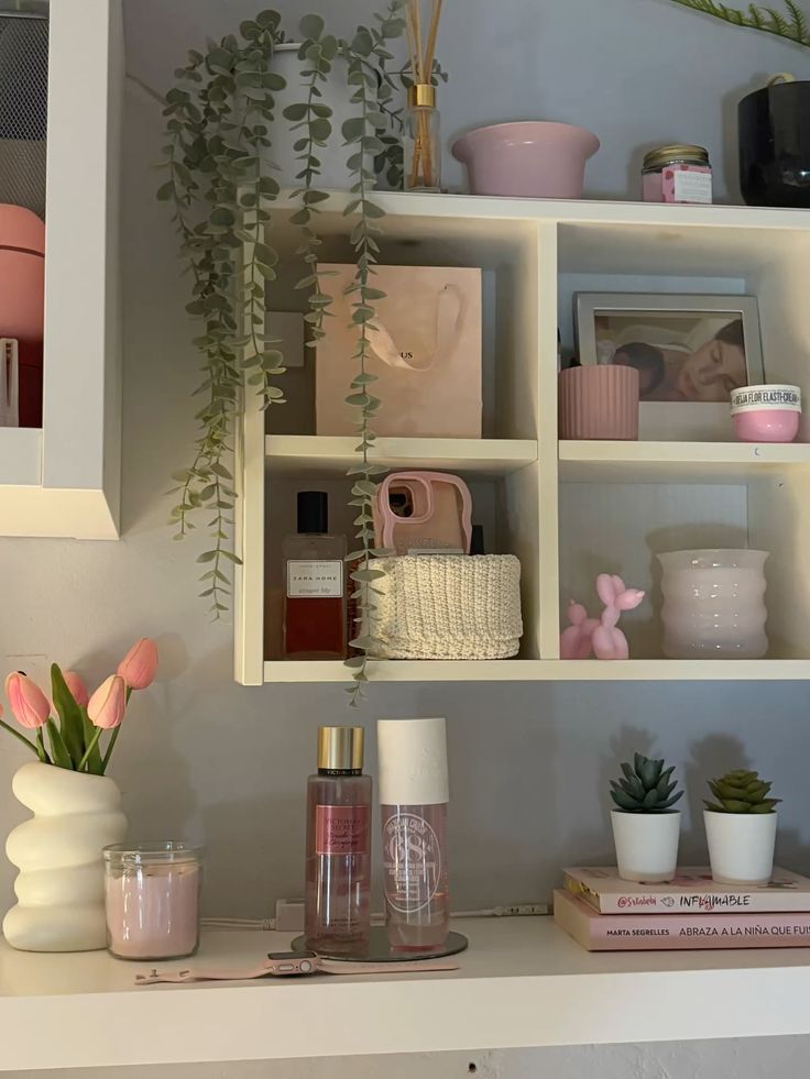 Chic shelf with plants, candles, skincare products, and decor in a cozy home setting.