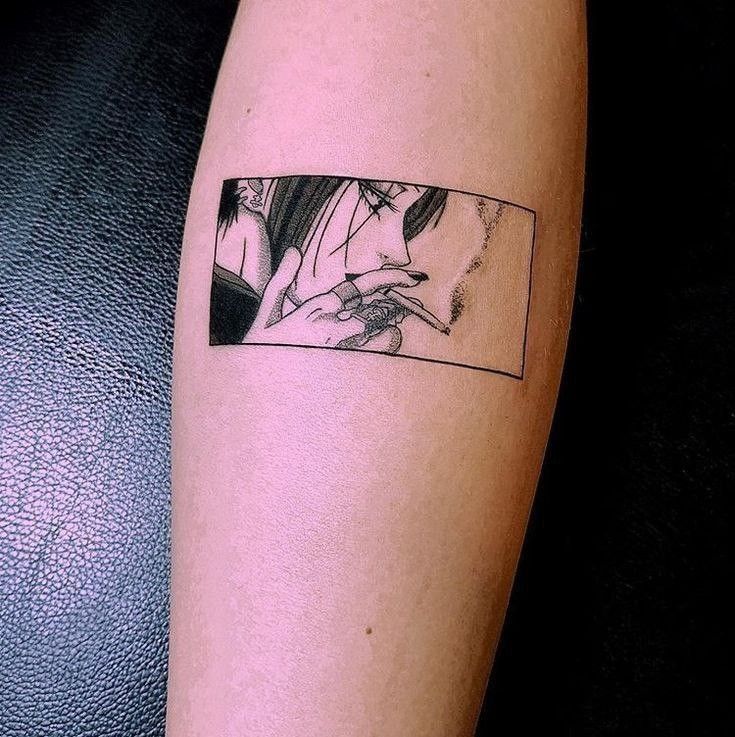 Tattoo of a detailed manga-style face with cigarette on forearm.