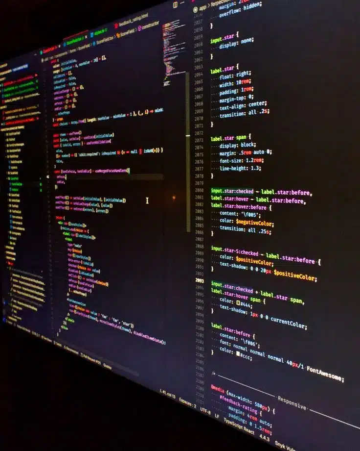 Colorful code on a dark screen, showcasing web development and programming in a text editor interface.