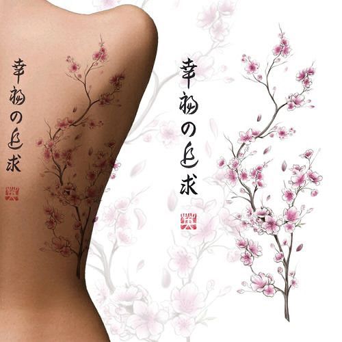 Floral tattoo design on a person's back with cherry blossoms and Japanese calligraphy on a white background.