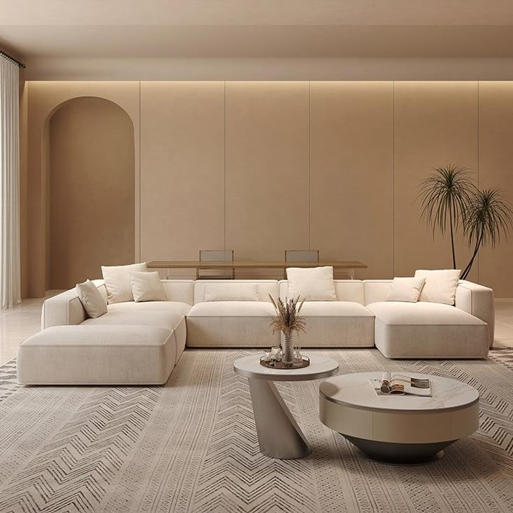 Modern beige living room with sectional sofa, stylish tables, and indoor plants. Contemporary, minimalist decor.