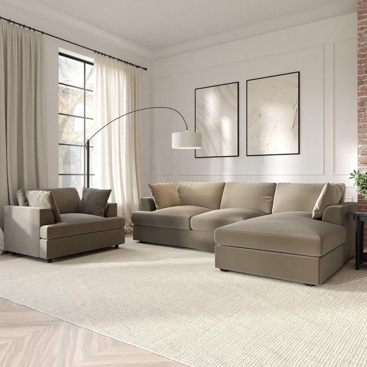 Modern living room with beige sectional sofa, accent chair, floor lamp, and wall art. Cozy and elegant decor.