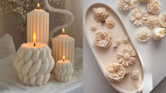 Three decorative candles with intricate patterns alongside floral candle molds on a table, enhancing cozy ambience.