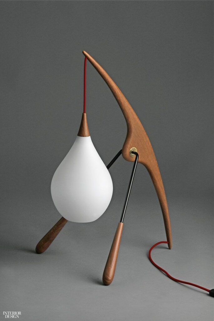 Lamps Design 6 Modern table lamp with wooden frame and white teardrop shade, red cord on gray background. | Sky Rye Design Modern table lamp with wooden frame and white teardrop shade, red cord on gray background.