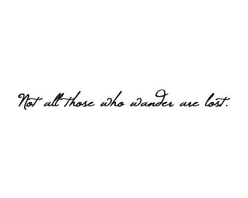 Cursive text quote: Not all those who wander are lost on a white background, emphasizing exploration and adventure.