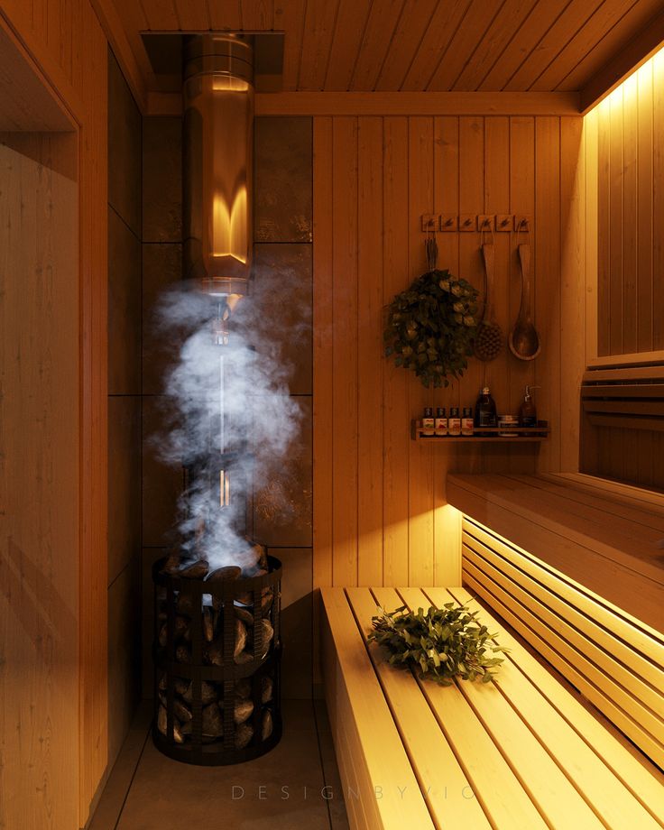 Cozy wooden sauna interior with a steaming stove, bench seating, and leafy decorations.