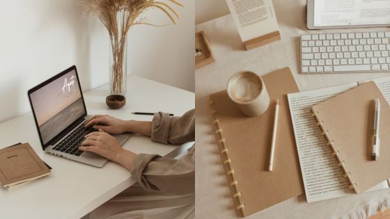 Person working on a laptop at a cozy desk with notebooks, pen, and coffee, creating a minimalist workspace vibe.