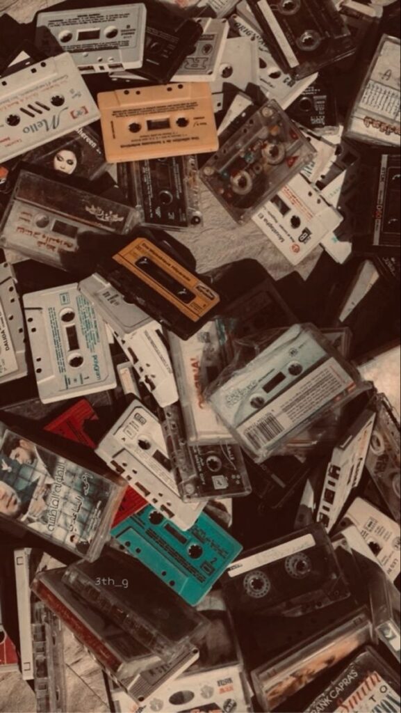 Pile of vintage audio cassette tapes in various colors, evoking nostalgia and retro vibes.