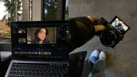 Laptop editing video outdoors; hand holding camera with flip screen selfie.