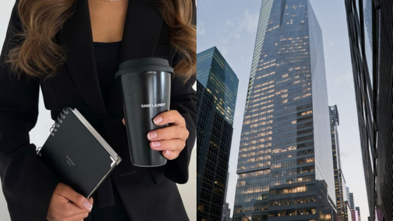 Businesswoman holds a coffee cup and planner next to a high-rise building in a cityscape.