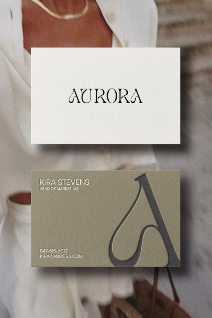 Elegant business card design for Aurora brand with contact details for Kira Stevens, Head of Marketing.