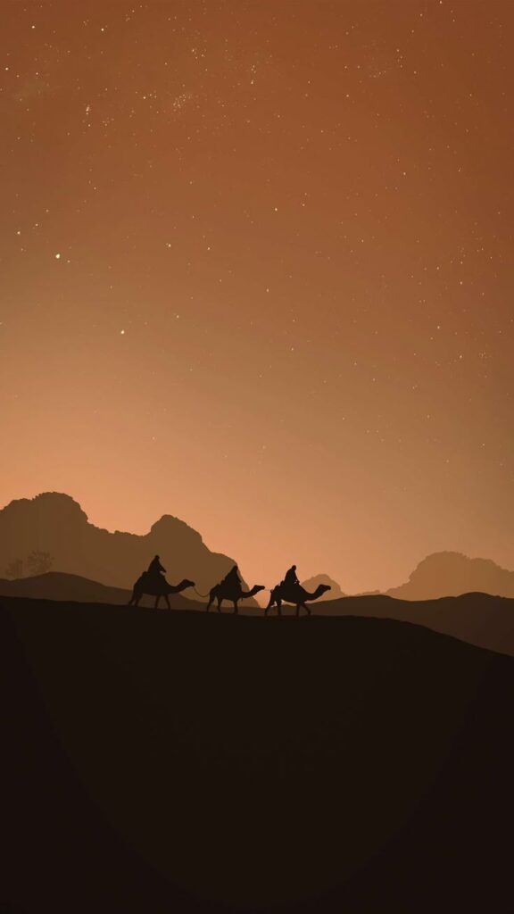 Silhouette of three camels and riders in desert at dusk under starry sky, orange horizon, mountains in background.