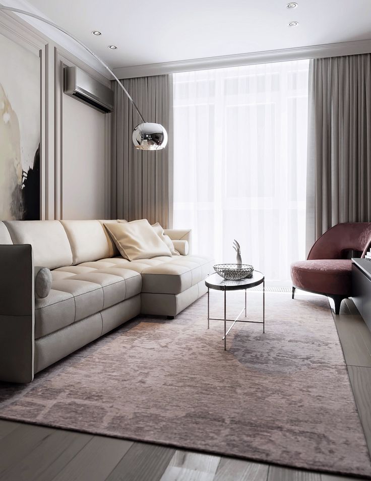 Modern minimalist living room design with cozy beige sofa, elegant decor, and stylish floor lamp.