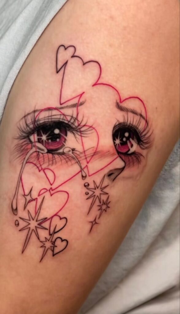 Tattoo of crying eyes with hearts and stars on an arm, blending emotional and cosmic elements.