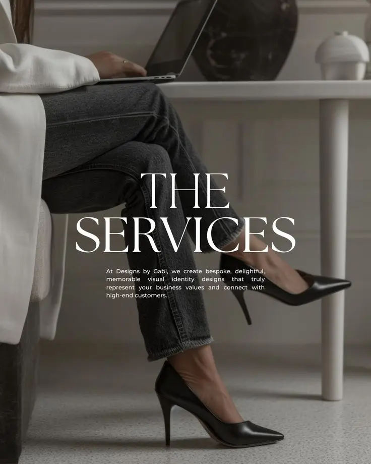 Person in heels using a laptop, text overlay The Services for design branding consultancy.